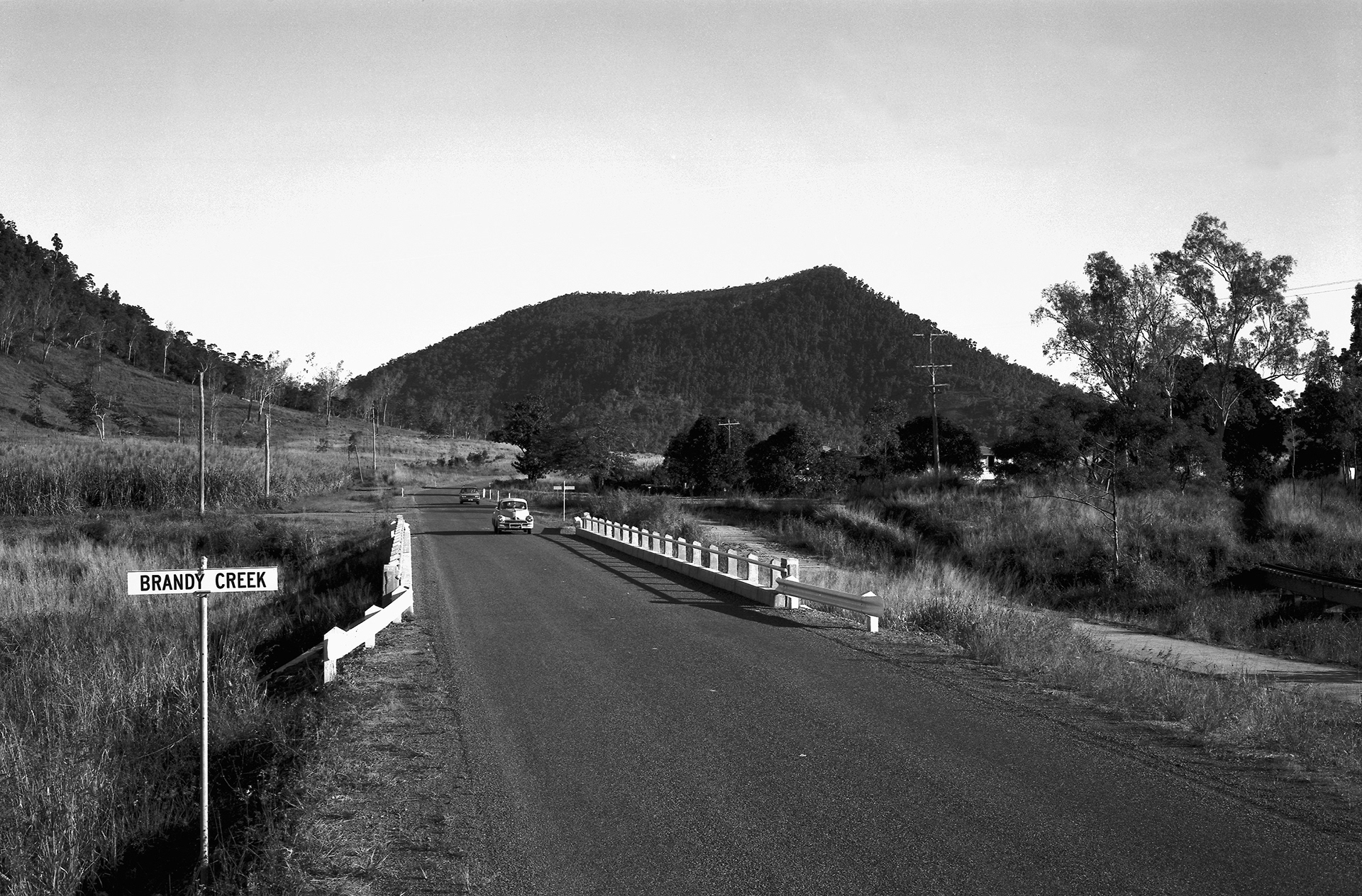 Car travelling on the Brandy Creek Bridge 9 miles east of Proserpine.