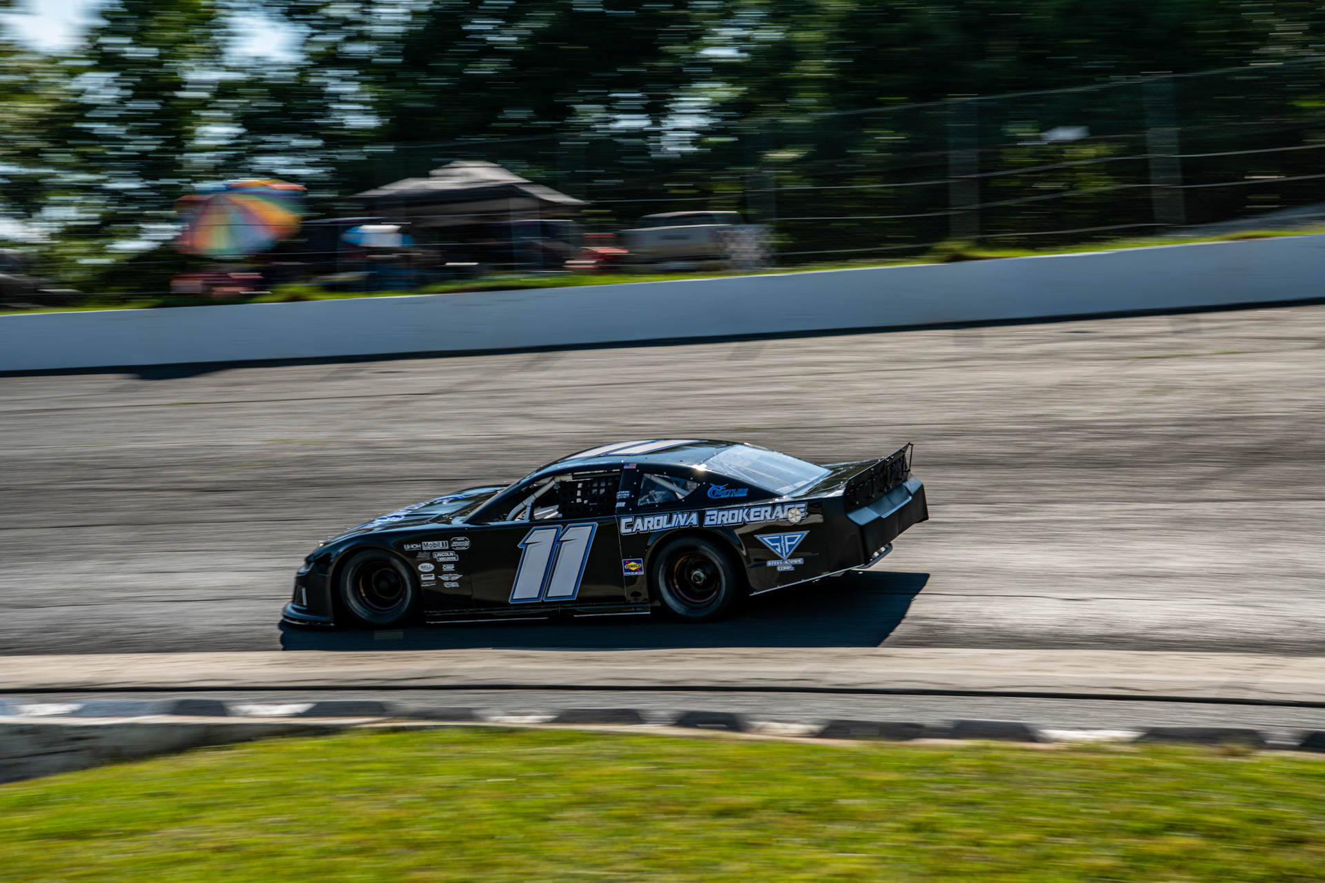 Blaise Brinkley passes through the 4th turn at Caraway Speedway during practice ahead of the Rusty Harpe Memorial on July 3, 2021.