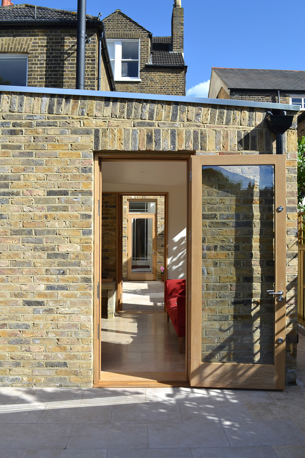 View through garden room extension and courtyard garden