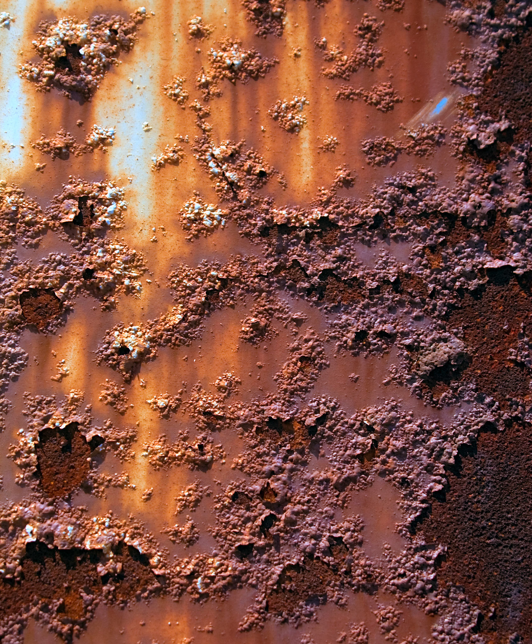 A closeup view of the rust on the side of an old train car at Charlestown Navy Yard in Boston MA.