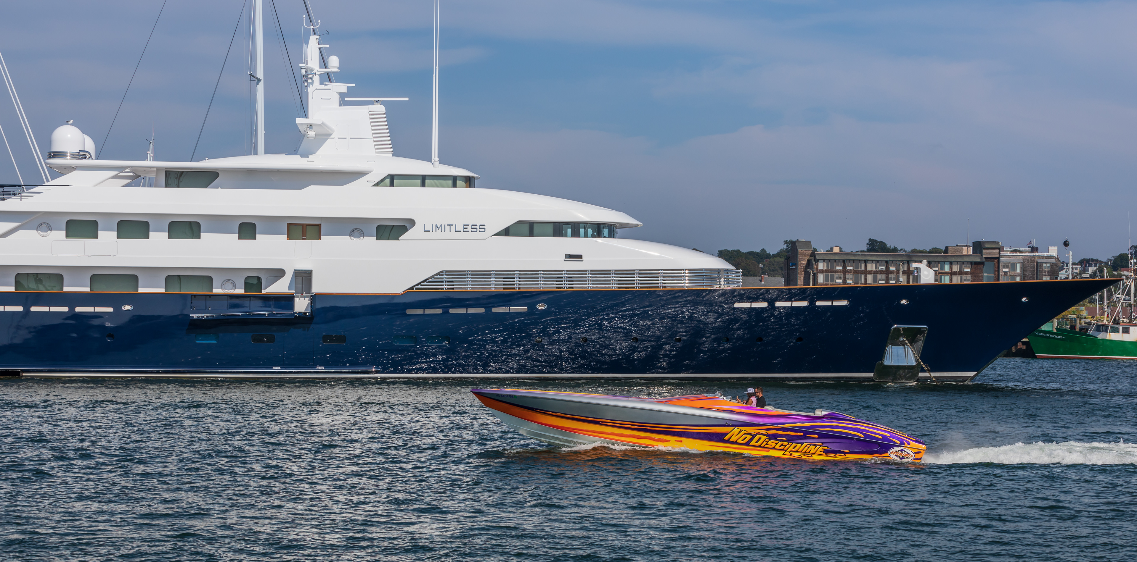 The Limitless superyacht and "No Discipline" power boat in Newport Harbor