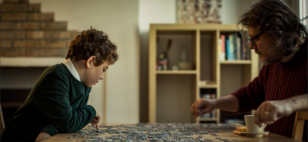 Father and son completing 1000 piece puzzle