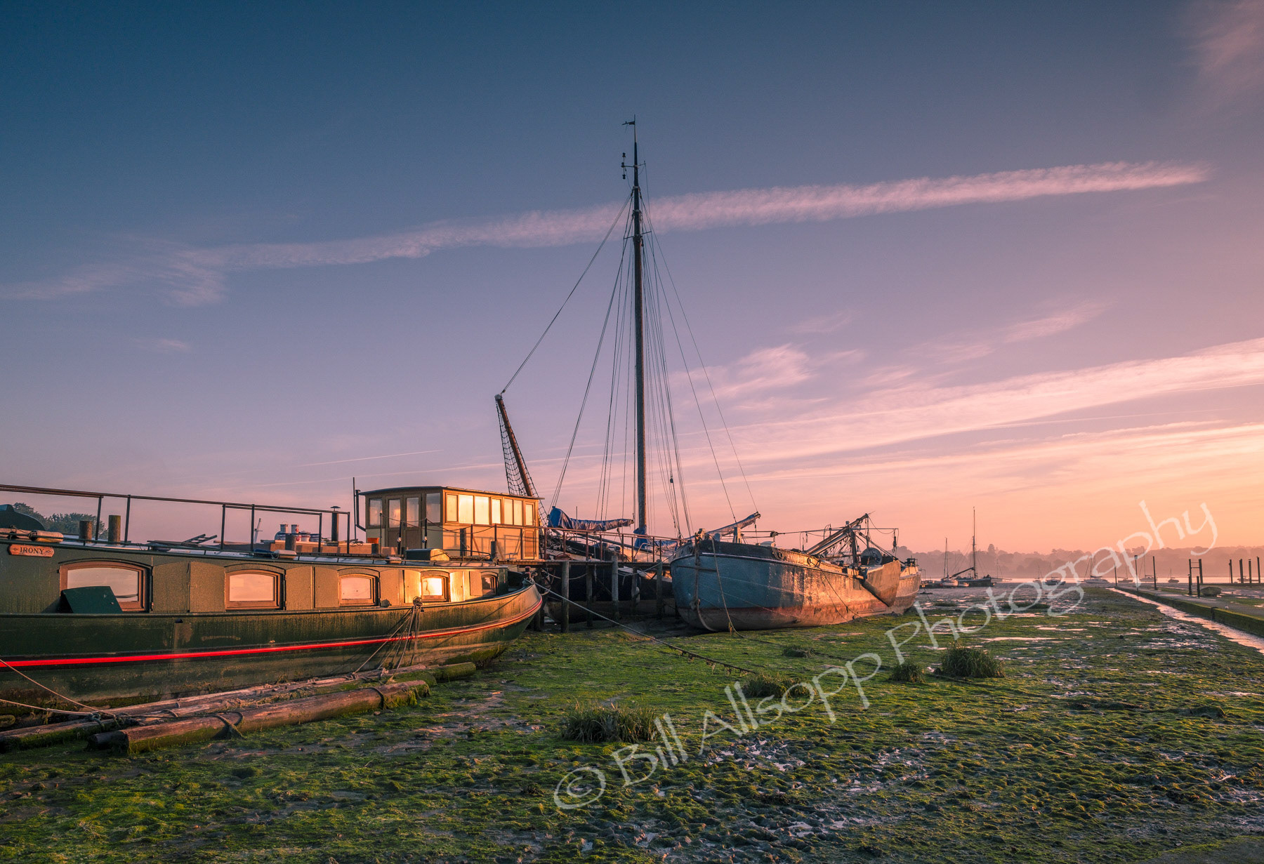 Barges lie on the mud at Pin Mill in Suffolk.