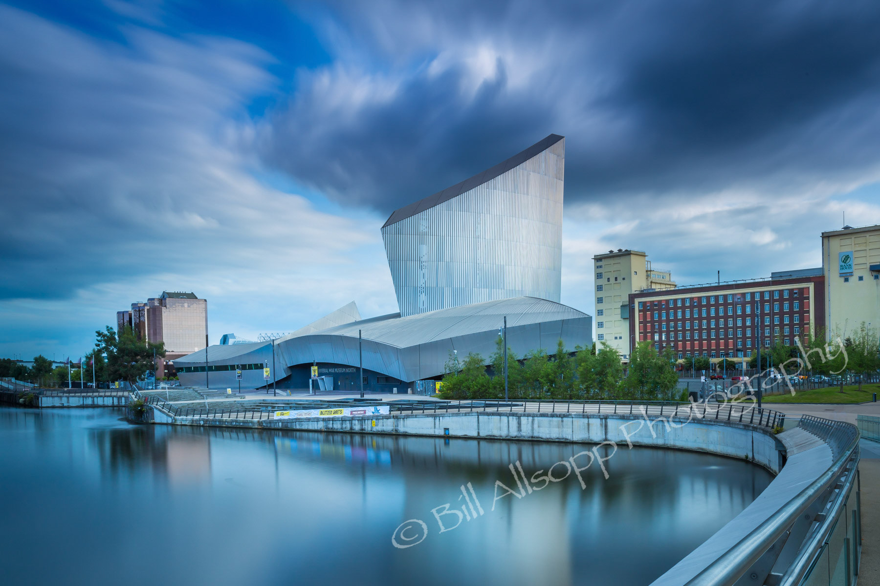 The Imperial War Museum North seen from the footbridge across the basin.