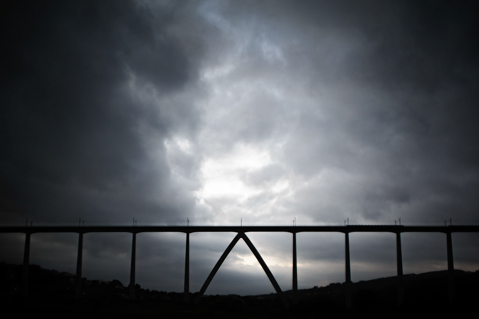 High-Speed Rail Viaduct. Santiago de Compostela, A Coruña, Galicia. High-speed rail requires the tracks to be as flat and straight as possible. Therefore, the fragmented orography of this part of Galicia has caused the cost of the line Ourense-Santiago to rocket up to €2.5 billion euros (of its 87 km, 50 km pass over a viaduct, or go through a tunnel). However, it has not been very much of a public success. During its first year of operation (2012), the trains did not even reached an occupancy rate of 20%, and there has not been a dramatic increase after that, in spite of the new policy of lower ticket prices.