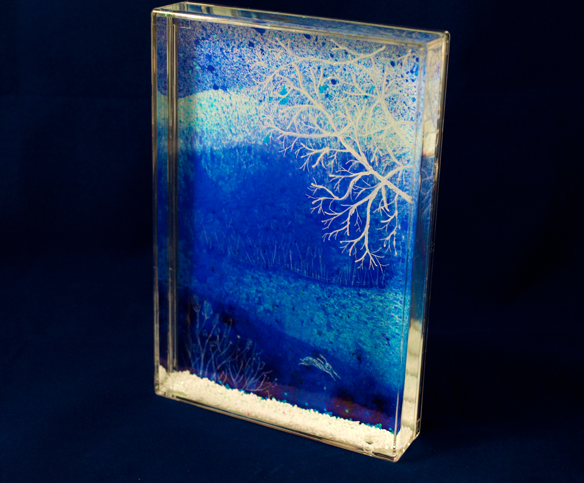 Wintry branches have been hand engraved into the surface of the acrylic to give a more 3 dimensional feel