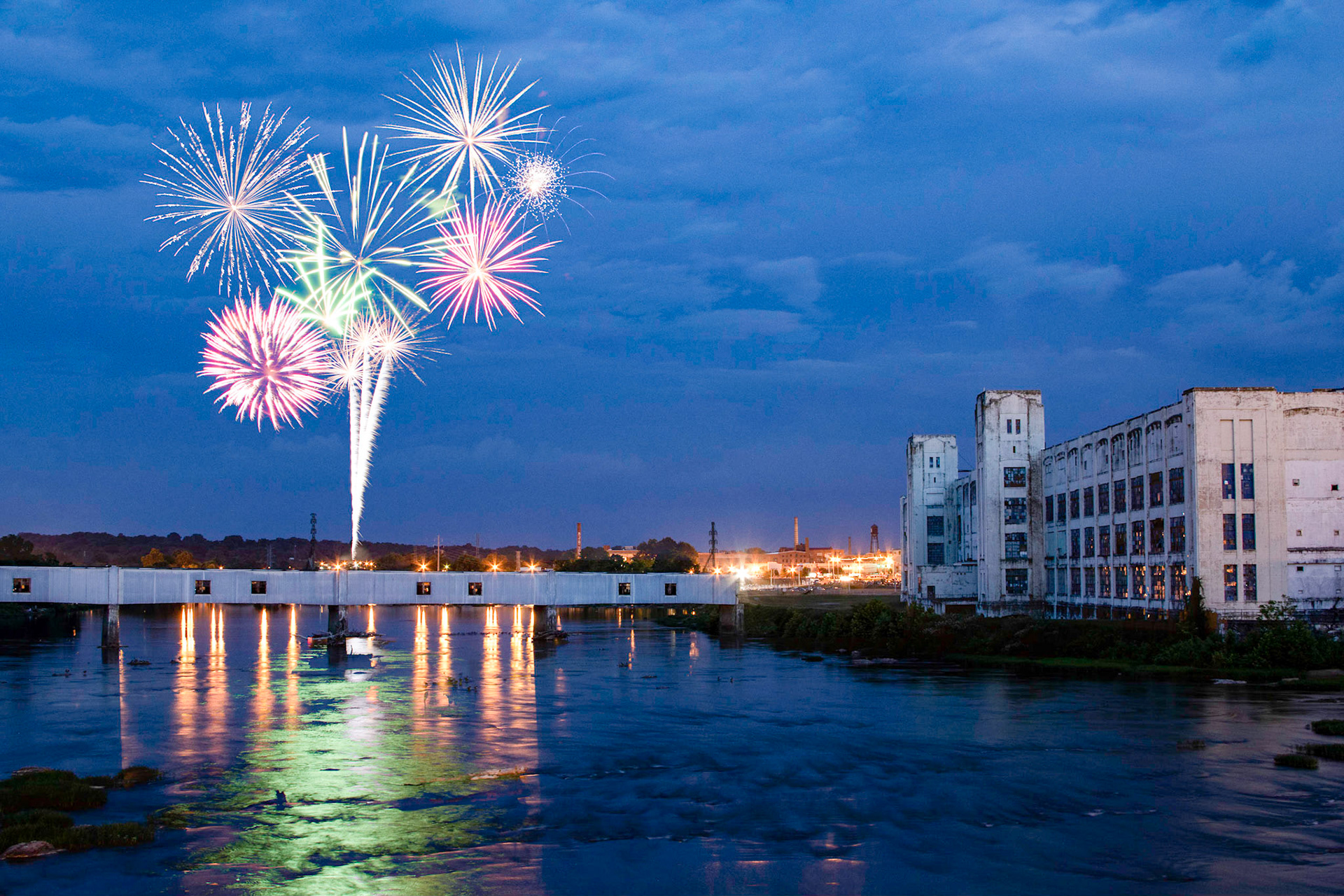 Fireworks along the Dan River in Danville, VA with the shuttered White Mill in the background