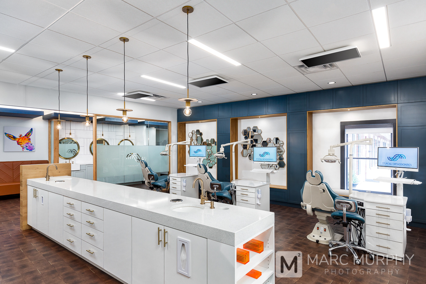 Sturgill Orthodontics Office Exam Room with Exam Chairs, Computers, Wall Mirrors and Pendant Lights