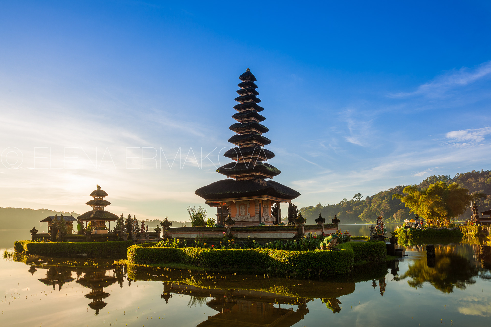 Pura Ulun Danu Bratan at sunrise, famous temple on the lake, Bedugul, Bali, Indonesia. Travel photography by Elena Ermakova.