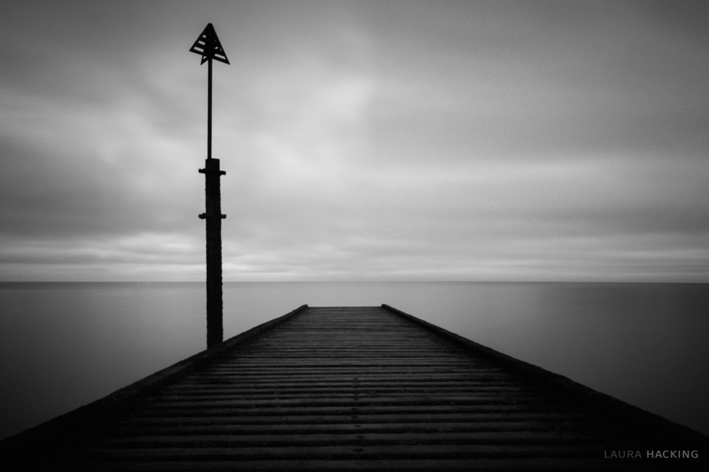 A black and white photograph of the jetty at Llandudno, North Wales.