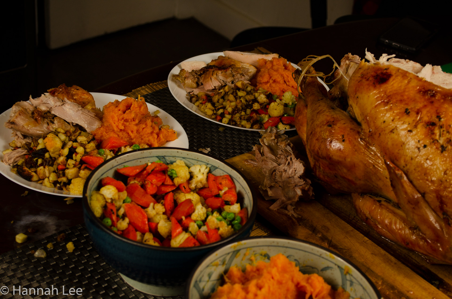 Plated thanksgiving dinner. next to the Turkey and the remaining side dishes: roasted vegetables, roasted butternut squash. Taken by Hannah Lee on November 26, 2020 in Somerville, MA. 1/60 second f 5.0 36 mm iso 250