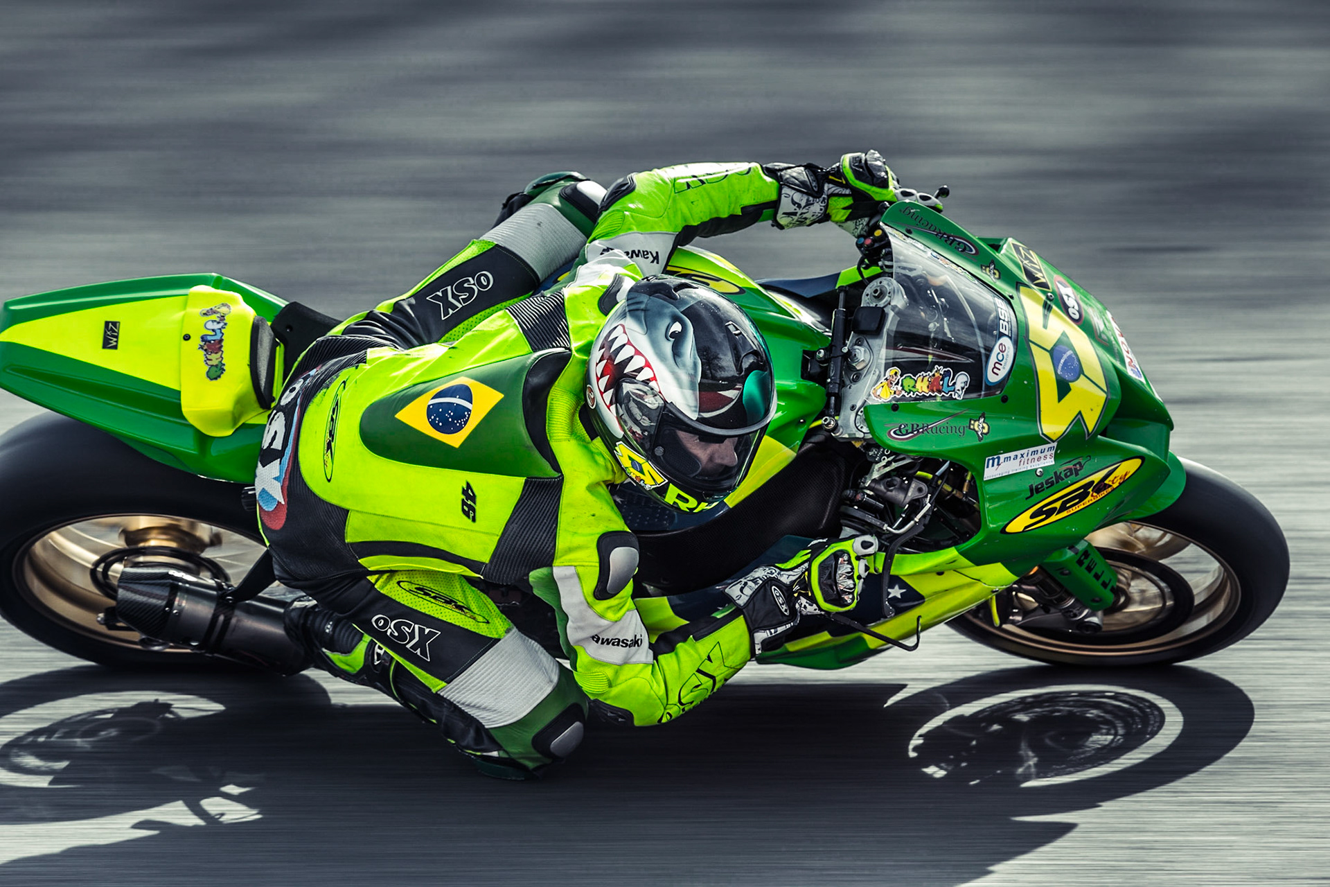 Rhalf Lo Turco on an 'SBKCity Kawasaki' concentrates as he takes Druid's Hairpin during a Superbike race at Brand's Hatch.
