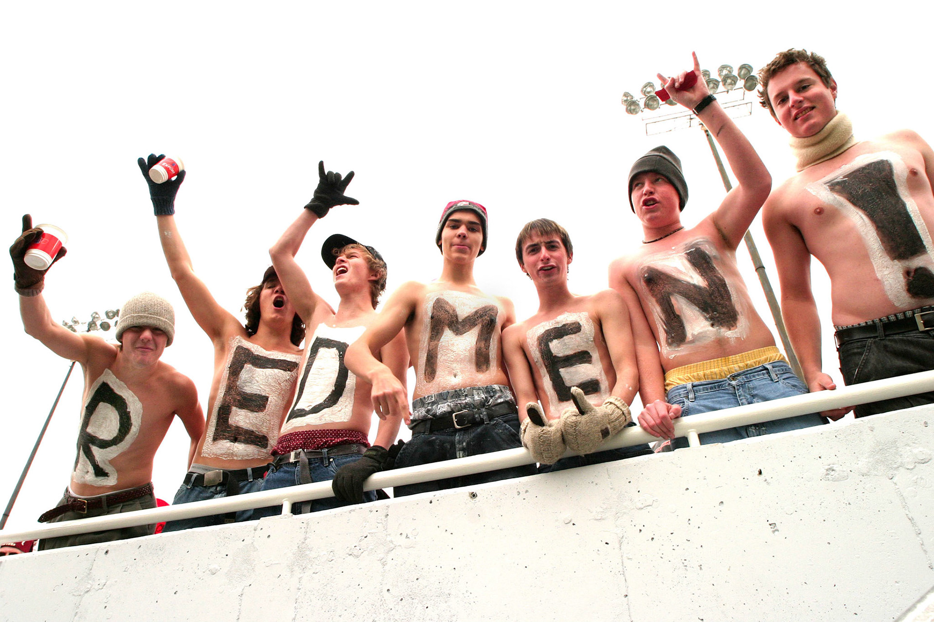Enthusiastic supporters at a football game. October 2003. The "Redmen" name for McGill's varsity men's teams has since been retired, with the new name to be announced soon.