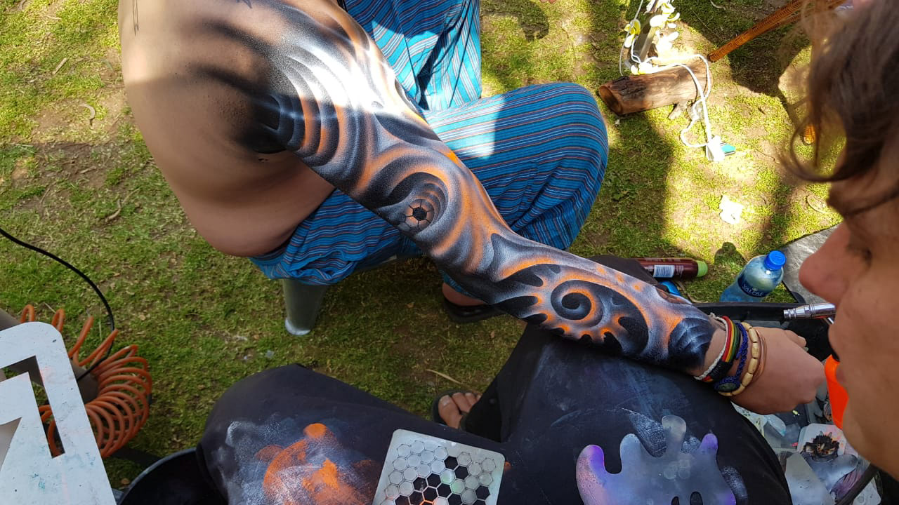 body art cosmic alien arm