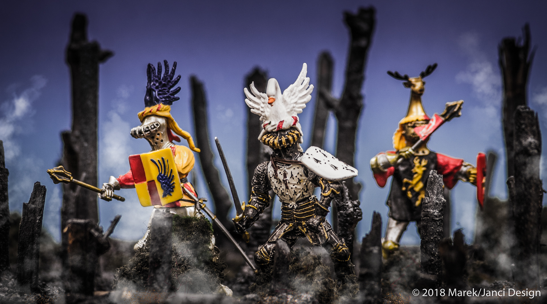 3 Schleich Knight toys in burned woods.