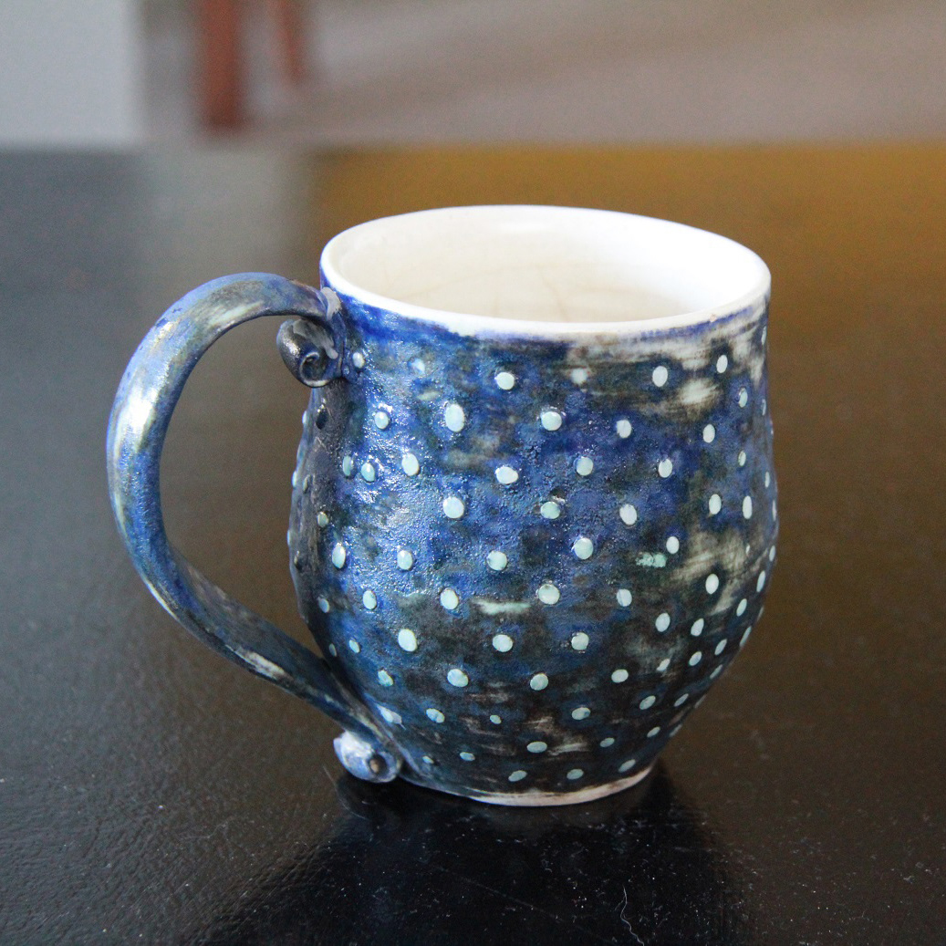 a thrown cup, earthenware