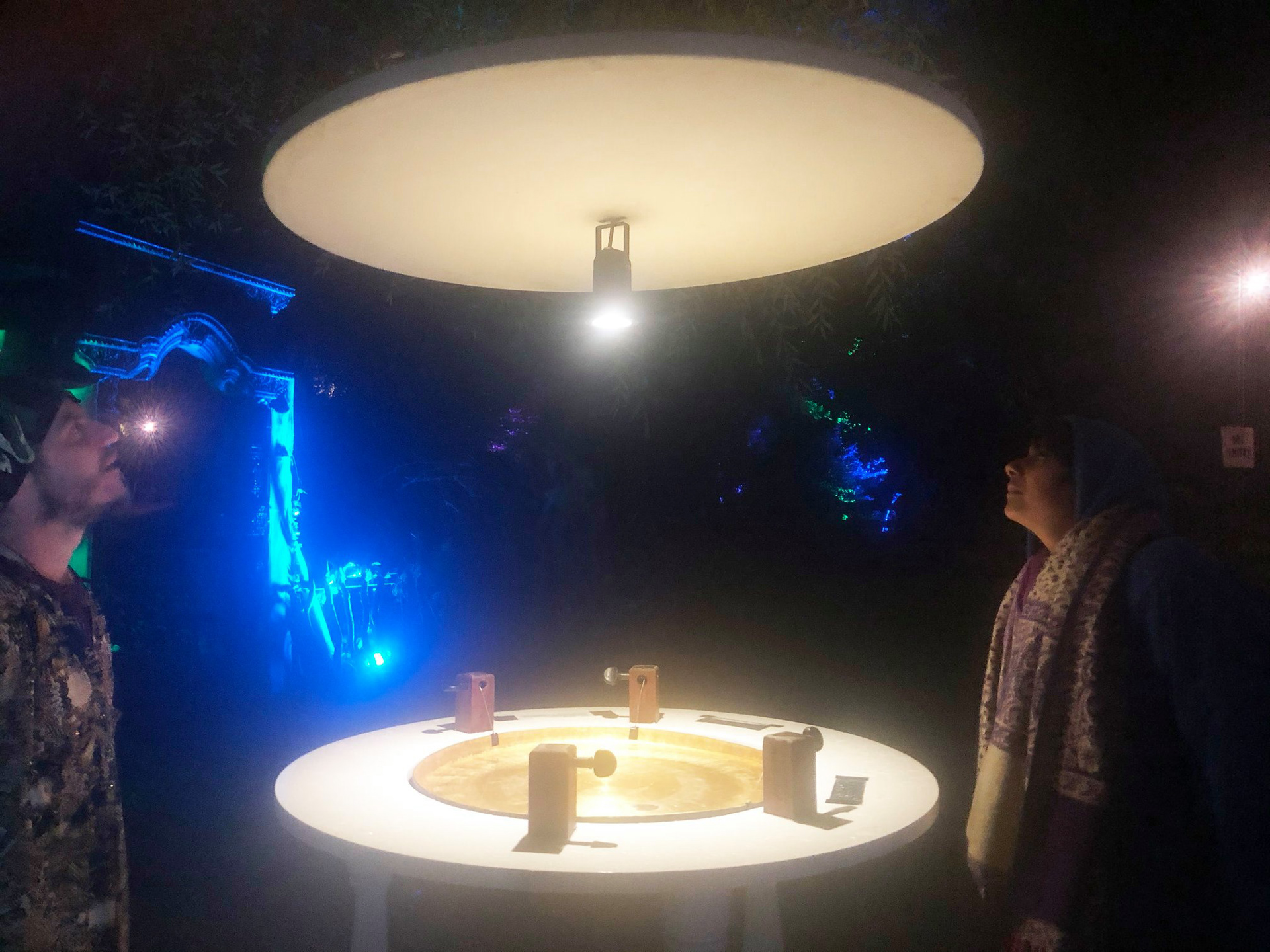 Golden Gong at night, making oscilloscope laser patterns off the water at night.