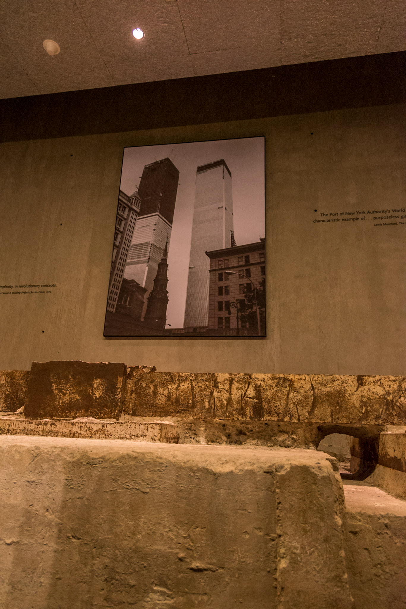 Picture of the original Twin Towers beyond the remains of part of their foundations, 9/11 Museum, Manhattan