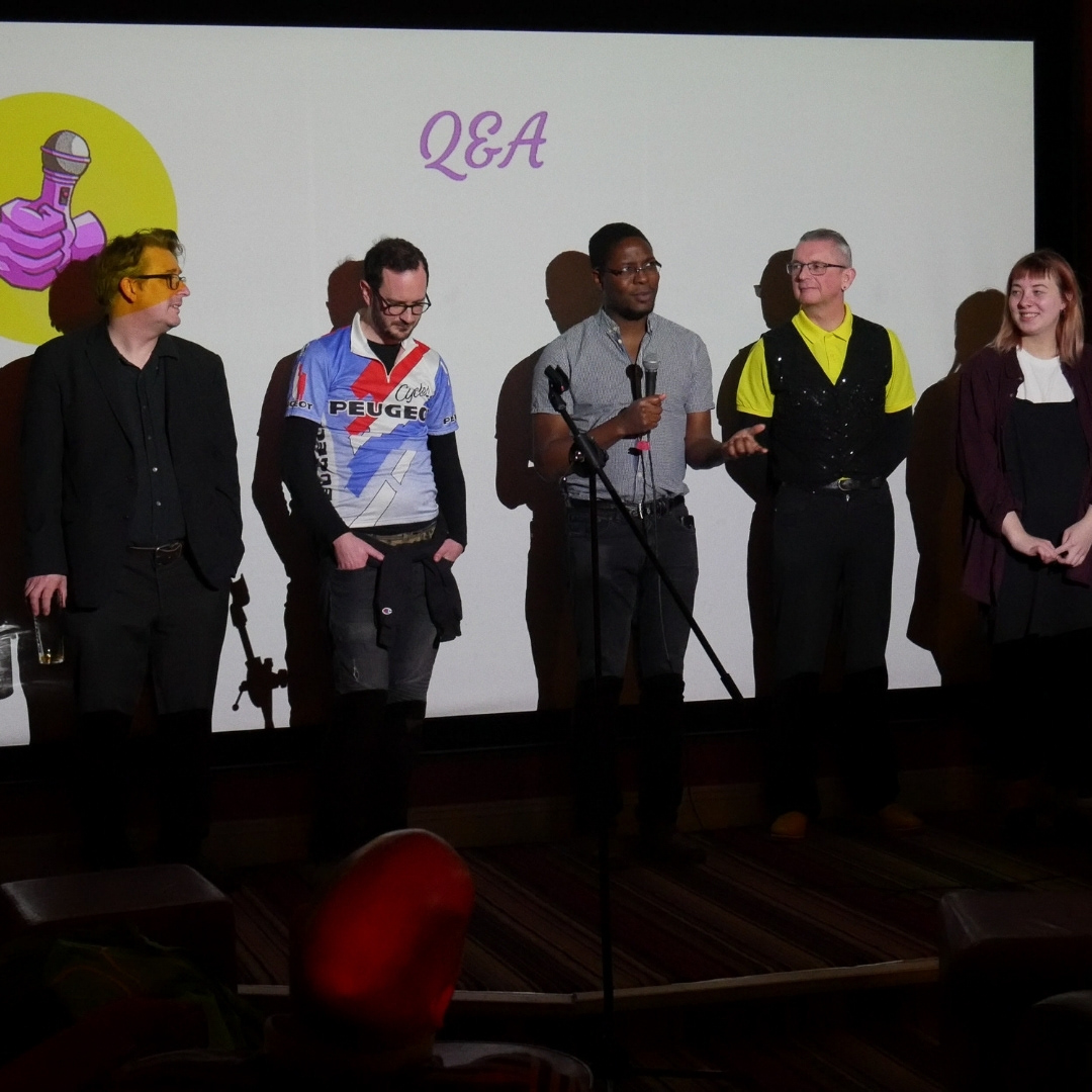 Poets and musicians panel answering audience questions during Q&A.