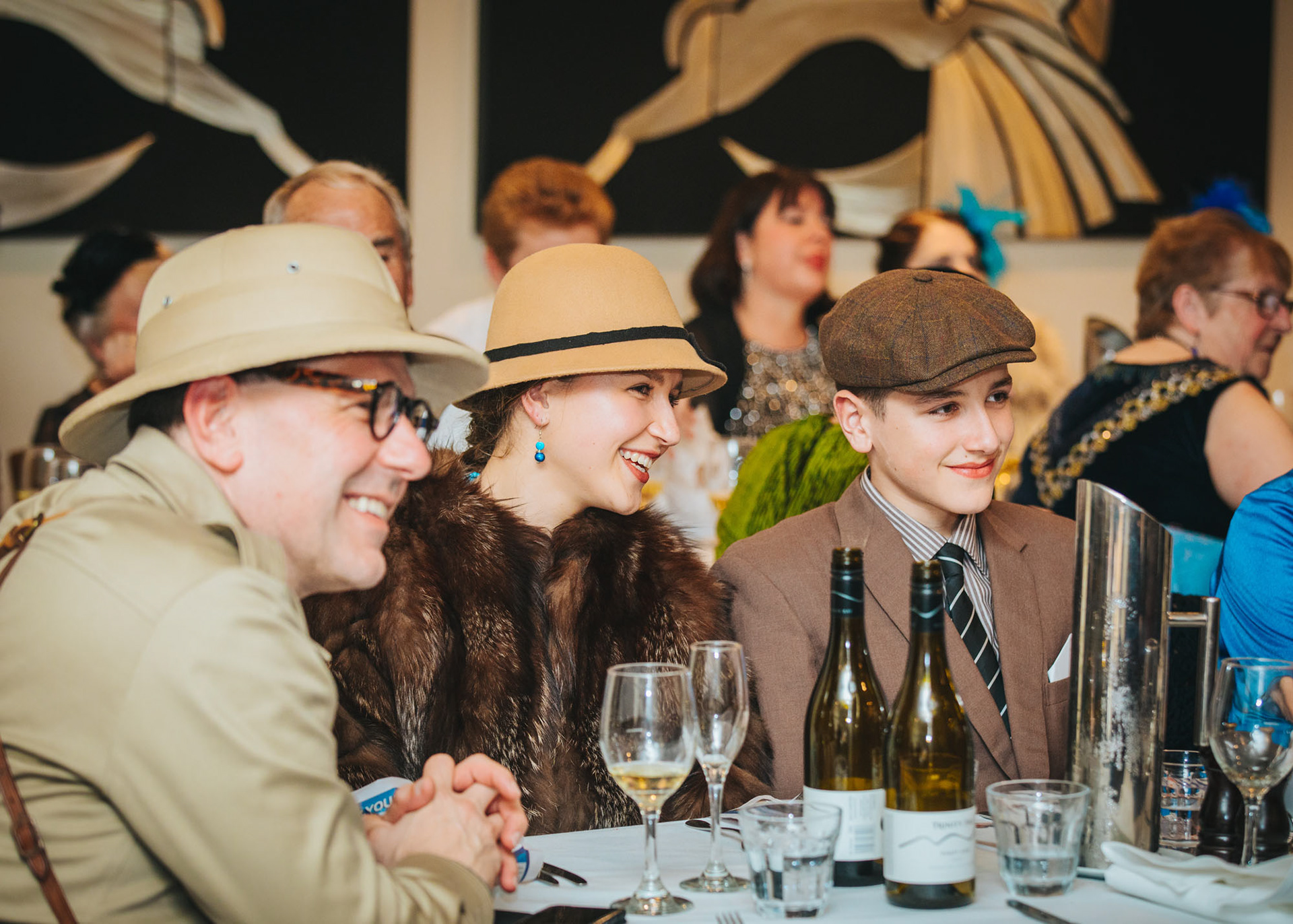 A family attending an evening event at the Winter Art Deco festival