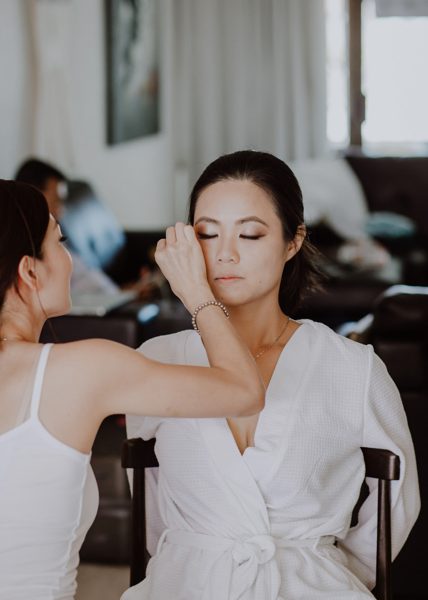 Bride Yifang having her makeup done for her wedding day