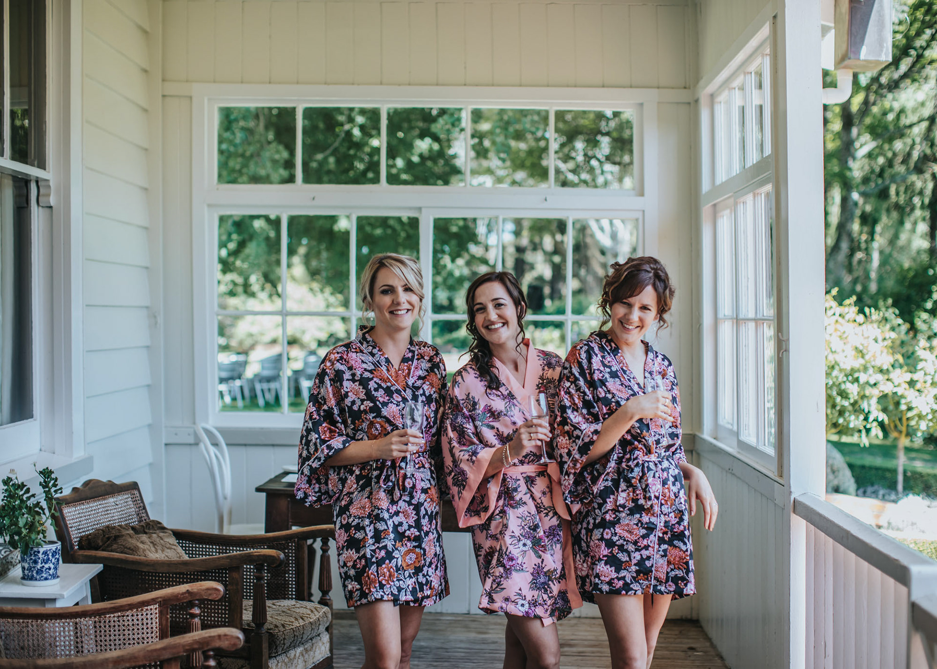 Bride Jenelle and her bridesmaids on the Wallingford Homestead balcony