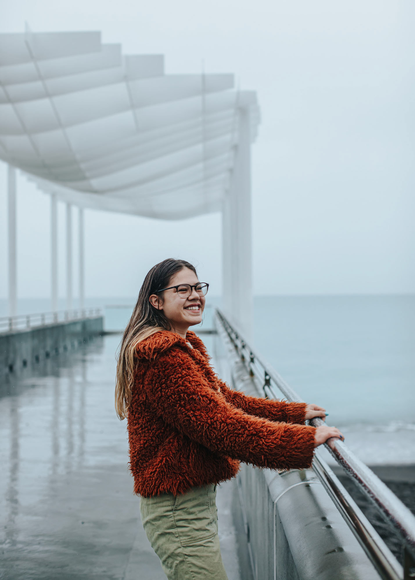 Young woman smiling while standing on Napier's viewing platform for marketing campaign