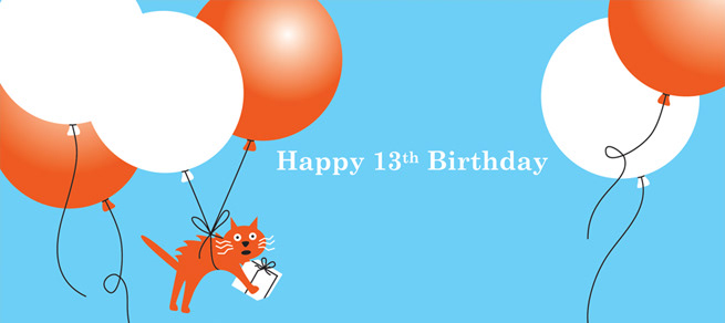Cat holding birthday present and floating with helium balloons; created for those turning 13 years of age.