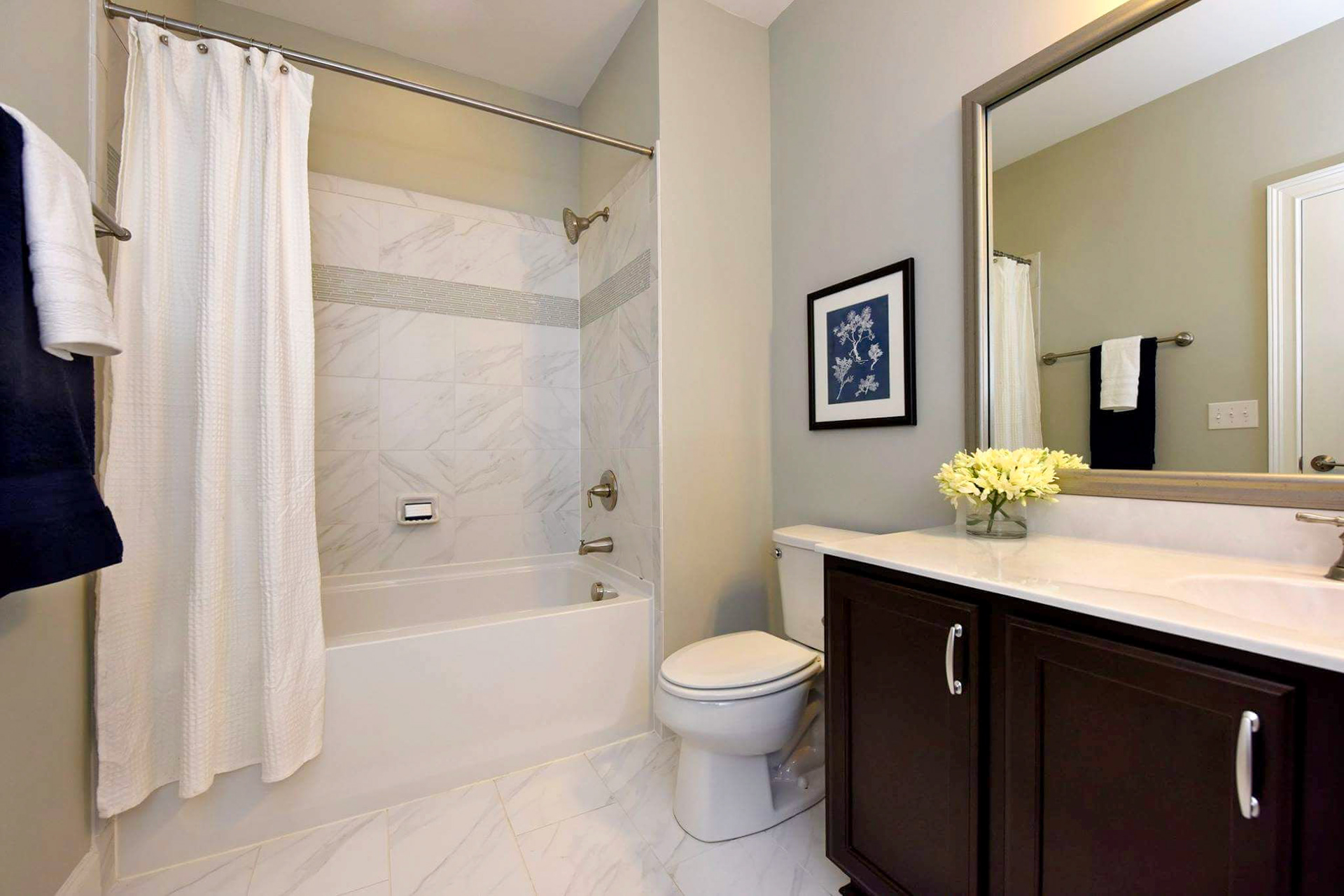 Personal Selections: Tile & lighting. Other selections made by Model Home Interiors. Photo Credit: Stanley Martin Homes.