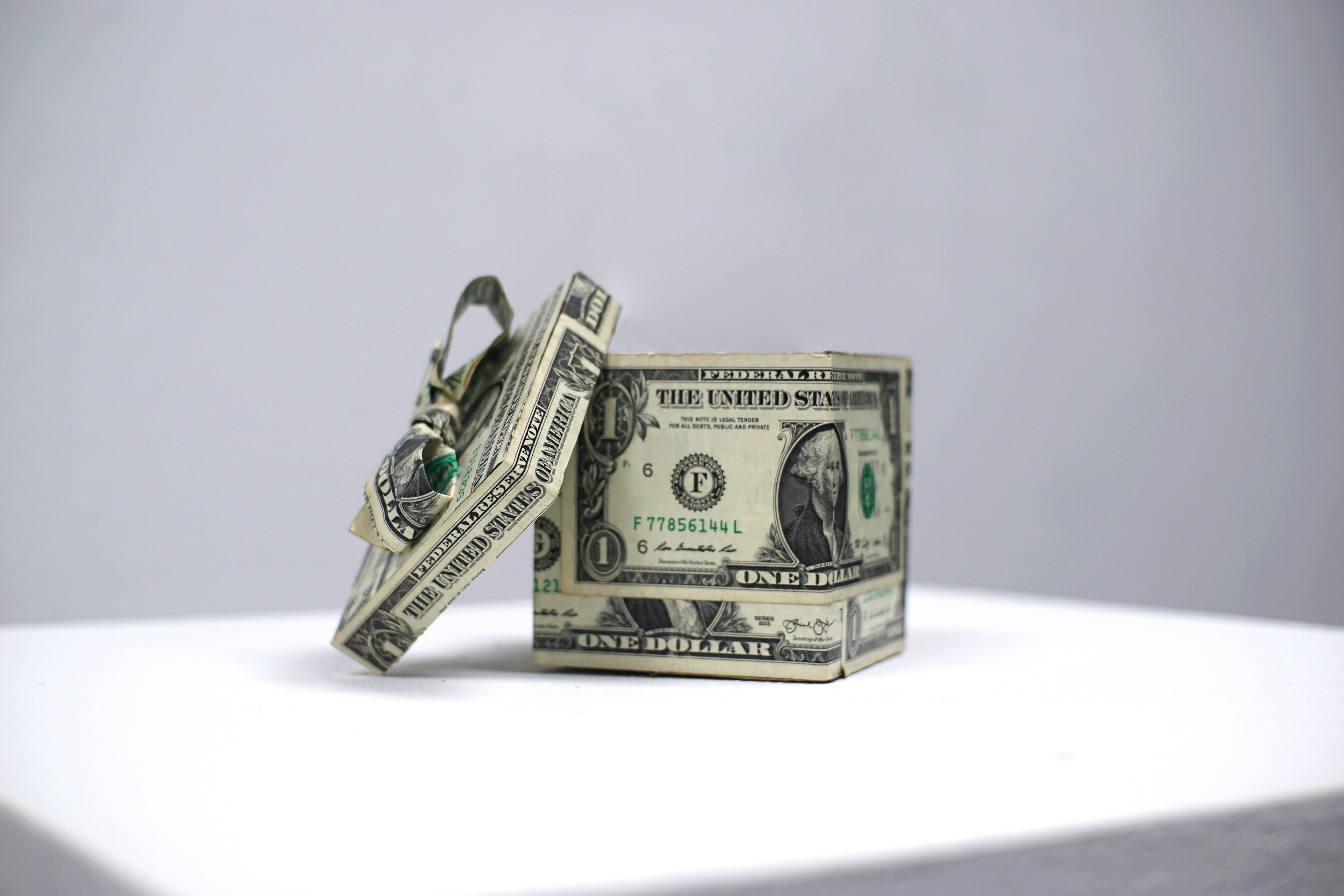 Sonia Royal, "$14 gift", 2018 14 dollar bills, cardboard, 4.5 × 3.5 × 3.5 inches