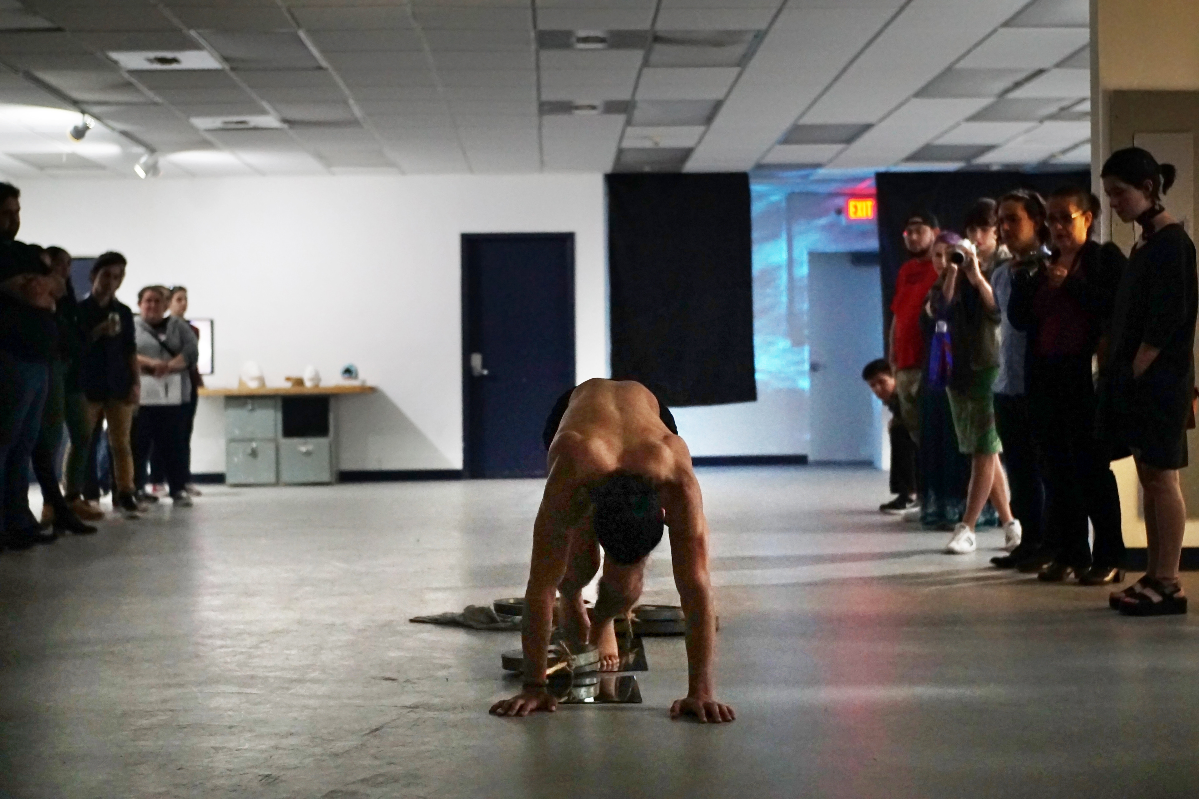 Justin Leary, "Versus Ego", 2018 Rope, mirror sheet, weights Performance, 8 mins