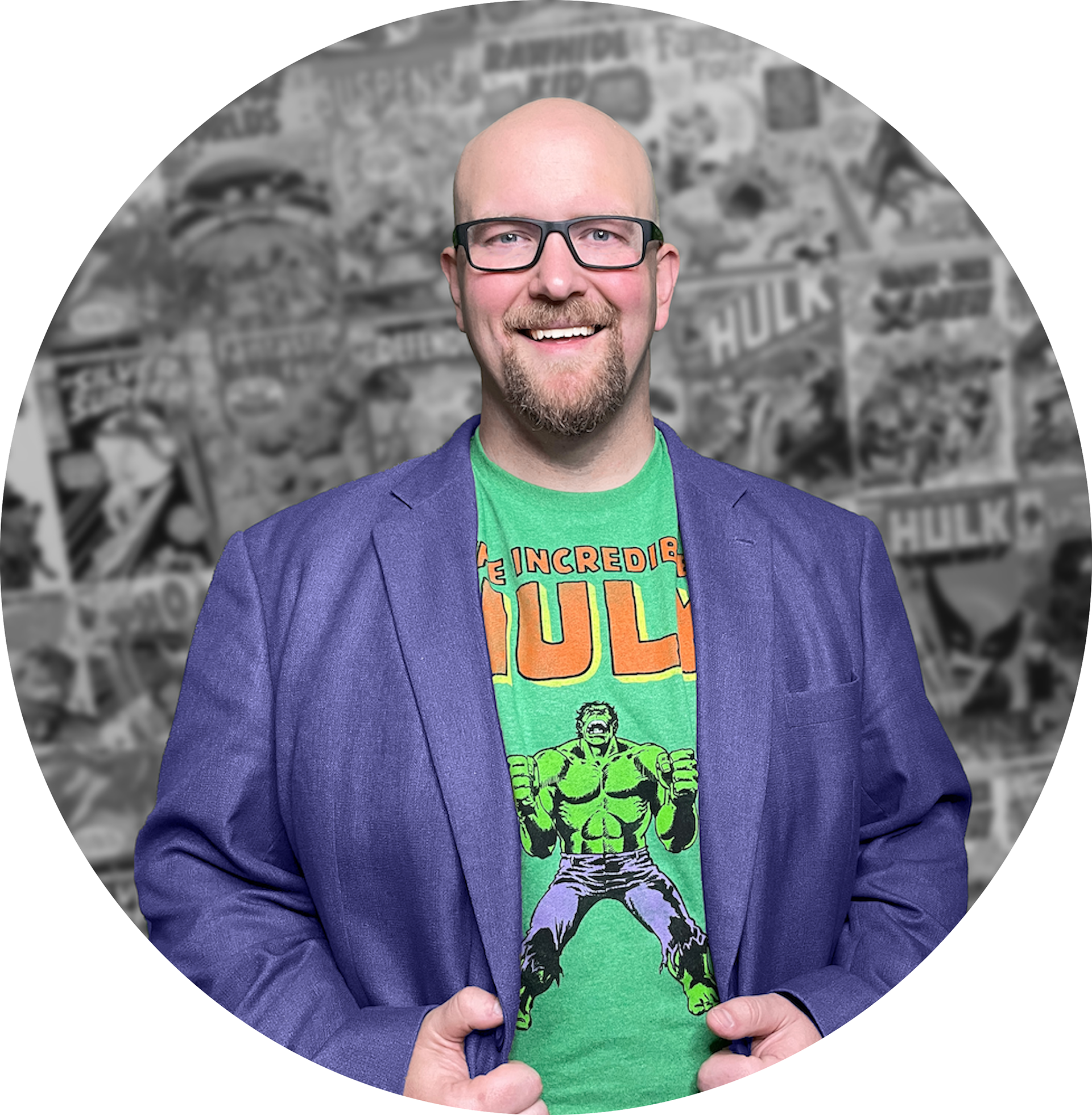 Sean Winningham in a Hulk inspired professional outfit, wearing a purple suit jacket and a green Hulk t shirt. In the background is a layout of multiple comic book covers.