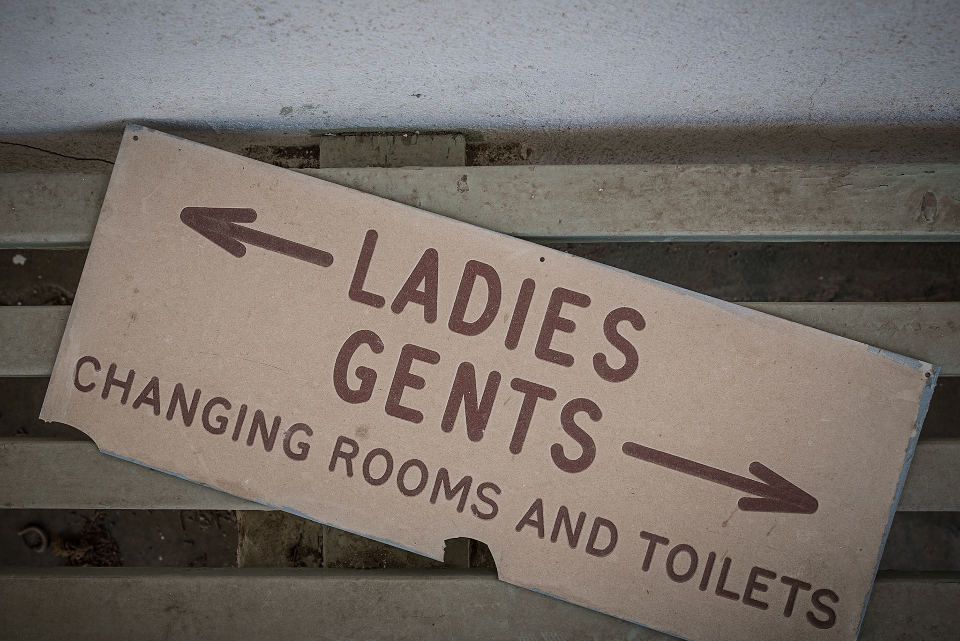 Sign in the swimming pool changing rooms at the abandoned Berengaria Village in Limassol, Cyprus