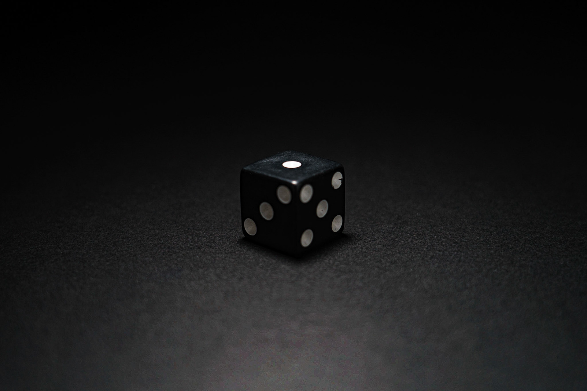 Top Lighting: Dice on black paper, 20201107, MILLER, Top lighting on the black dice on black paper was hard to keep the paper from getting washed out. Top lighting is similar to front lighting, where it doesn't offer much drama to the shot. Camera Settings: Sony A7II, ISO 200, 51mm, f4.5, 1/30s