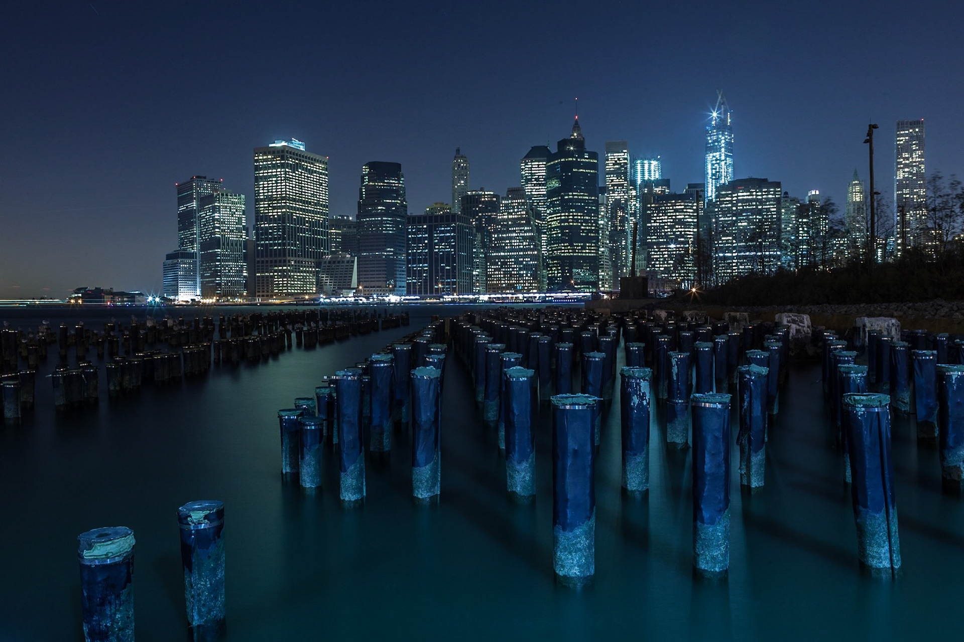 View from Pier 1 at Brooklyn Bridge Park over the East River towards Downtown Manhattan at night