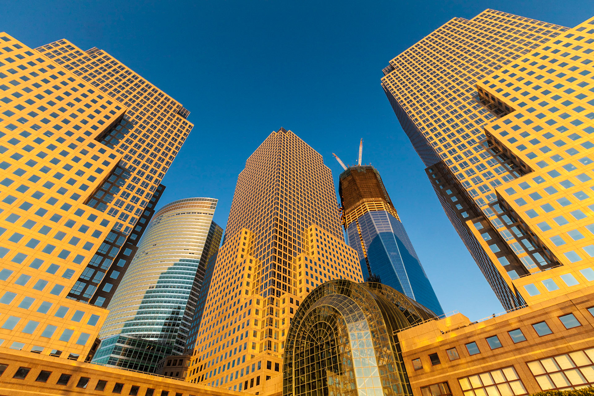 Late afternoon light on the World Financial Center buildings in Battery Park City (with the rising new World Trade Center and the Winter Garden)