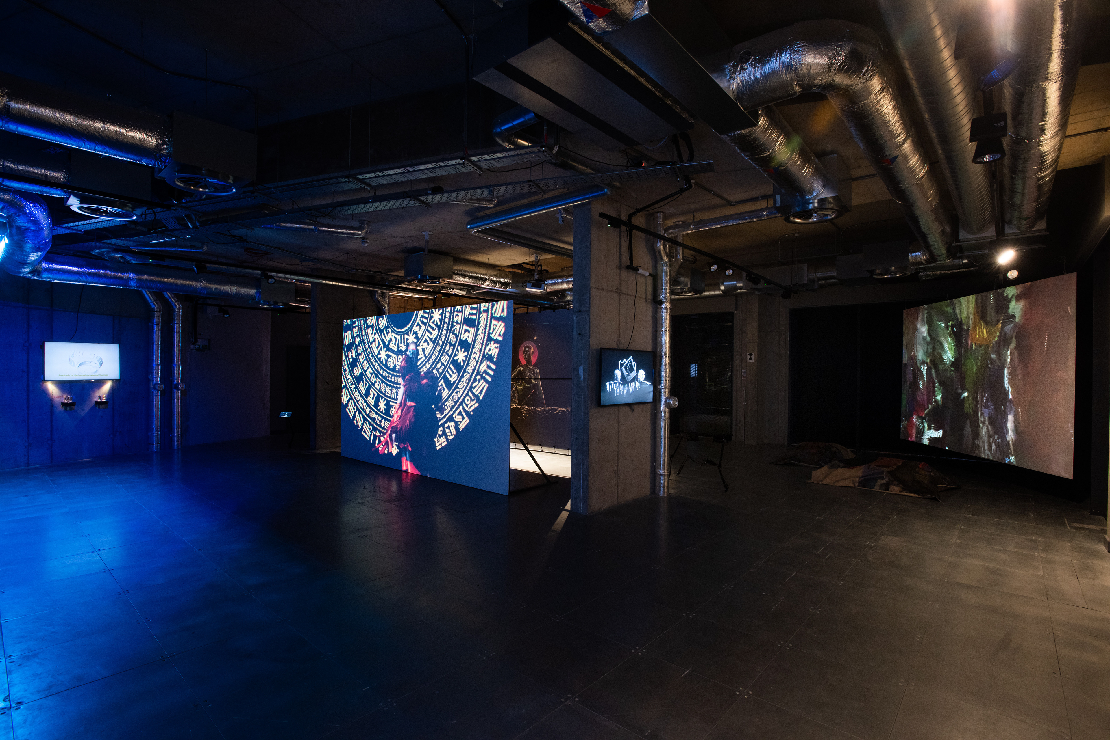 Installation view of POWERPLAY at arebyte Gallery, 2020. Featuring works by Mr Color, Bolatito Aderemi Ibitola, Vincent Bezuidenhout, Scumboy, King Debs, Mbakisi Sibanda, Kumbirai Makumbe, and Isaac Kariuki. Image: Max Colson.