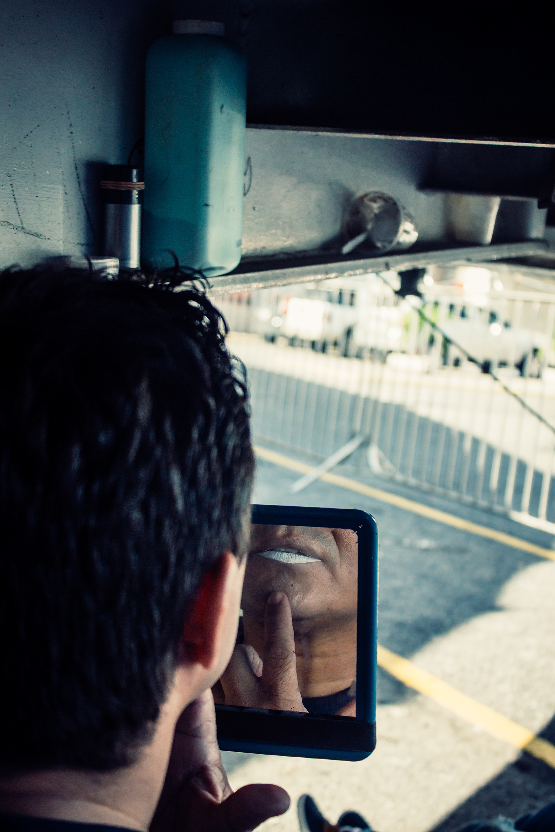 One of the clowns putting make up under one of the circus trucks. Caracas 2015