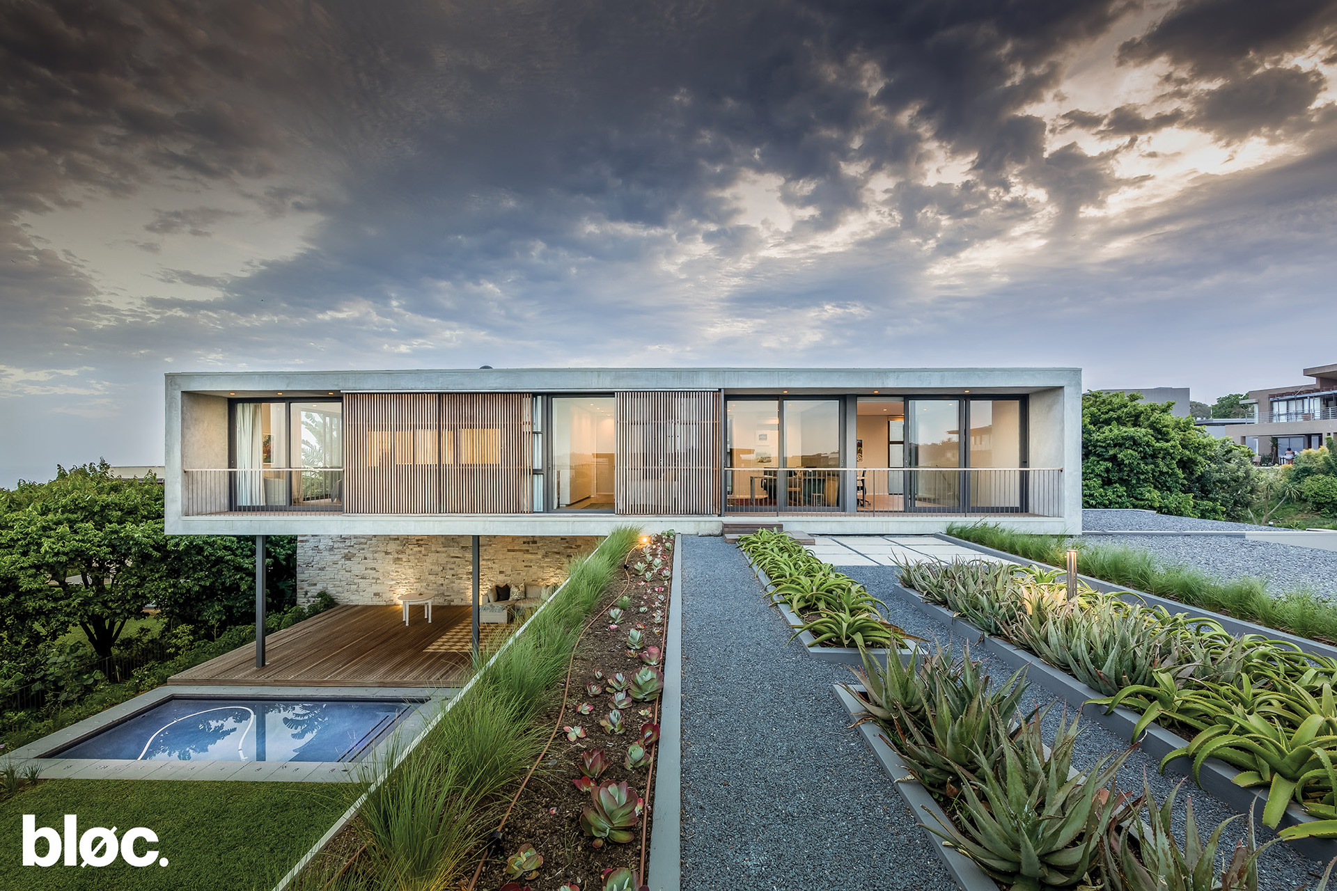 Modern double storey home with outdoor entertainment area and planted roof