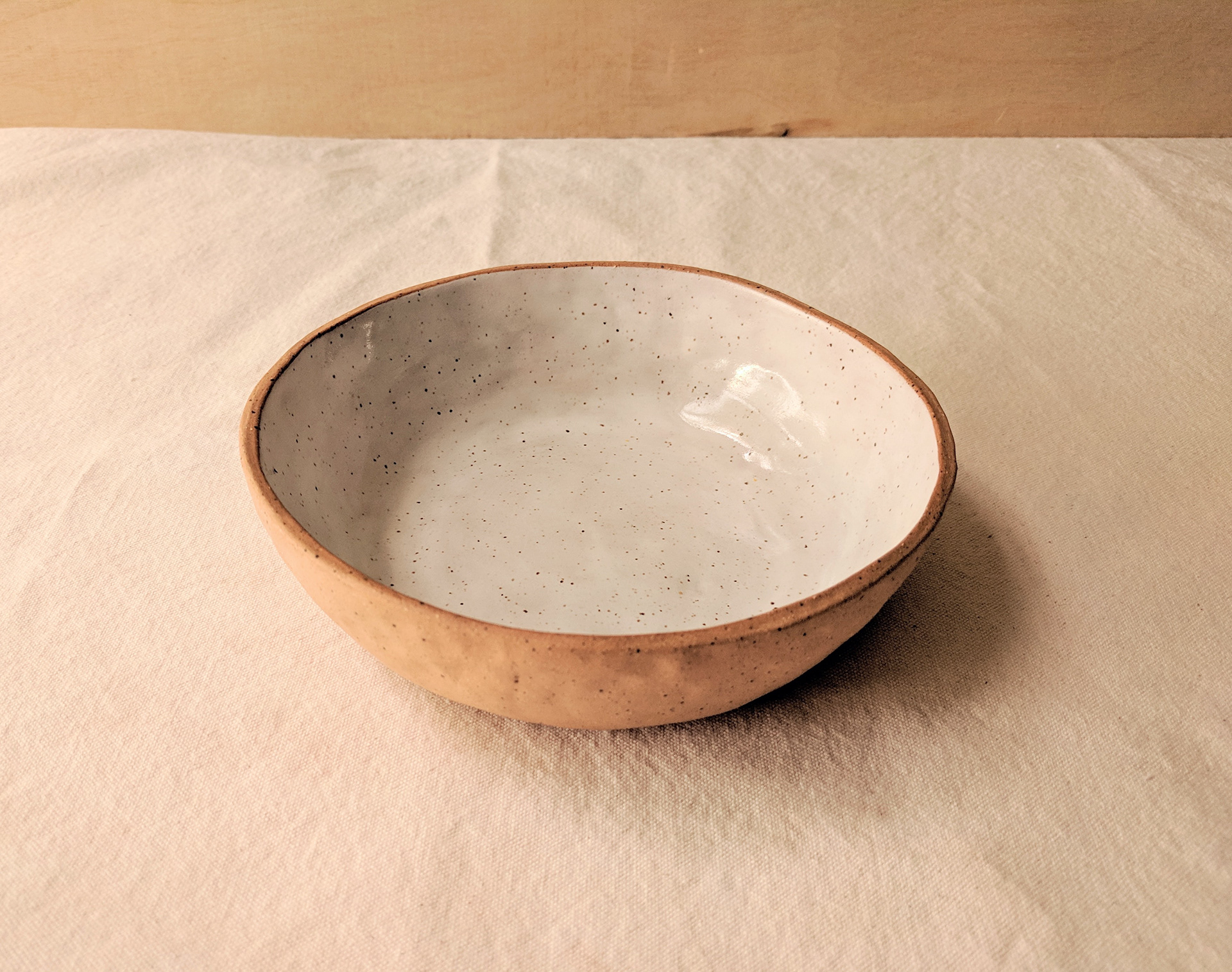 Brown speckled clay bowl