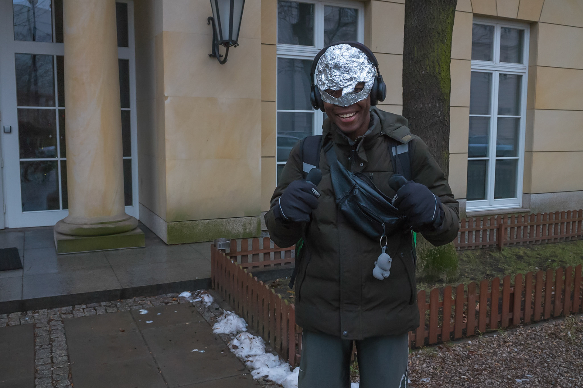 Delivery guy in aluminium foil helmet