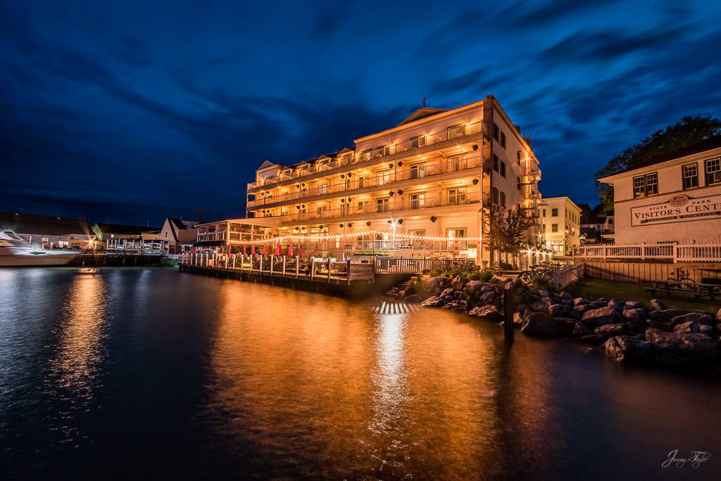 Mackinac Island at night, Chippewa Hotel and Pink Pony waterfront with reflection