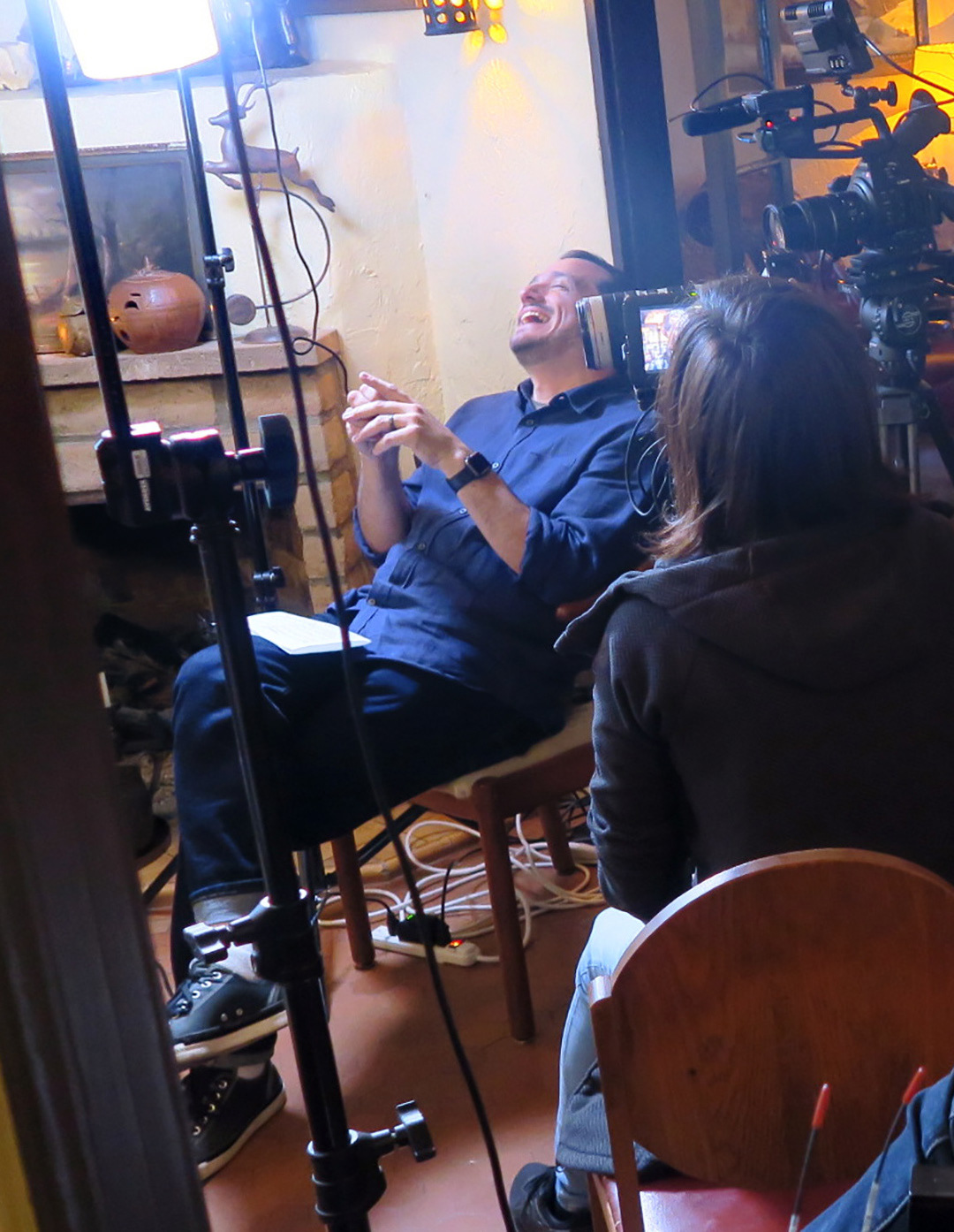 Conducting and interview on the set of "Dear Ike"