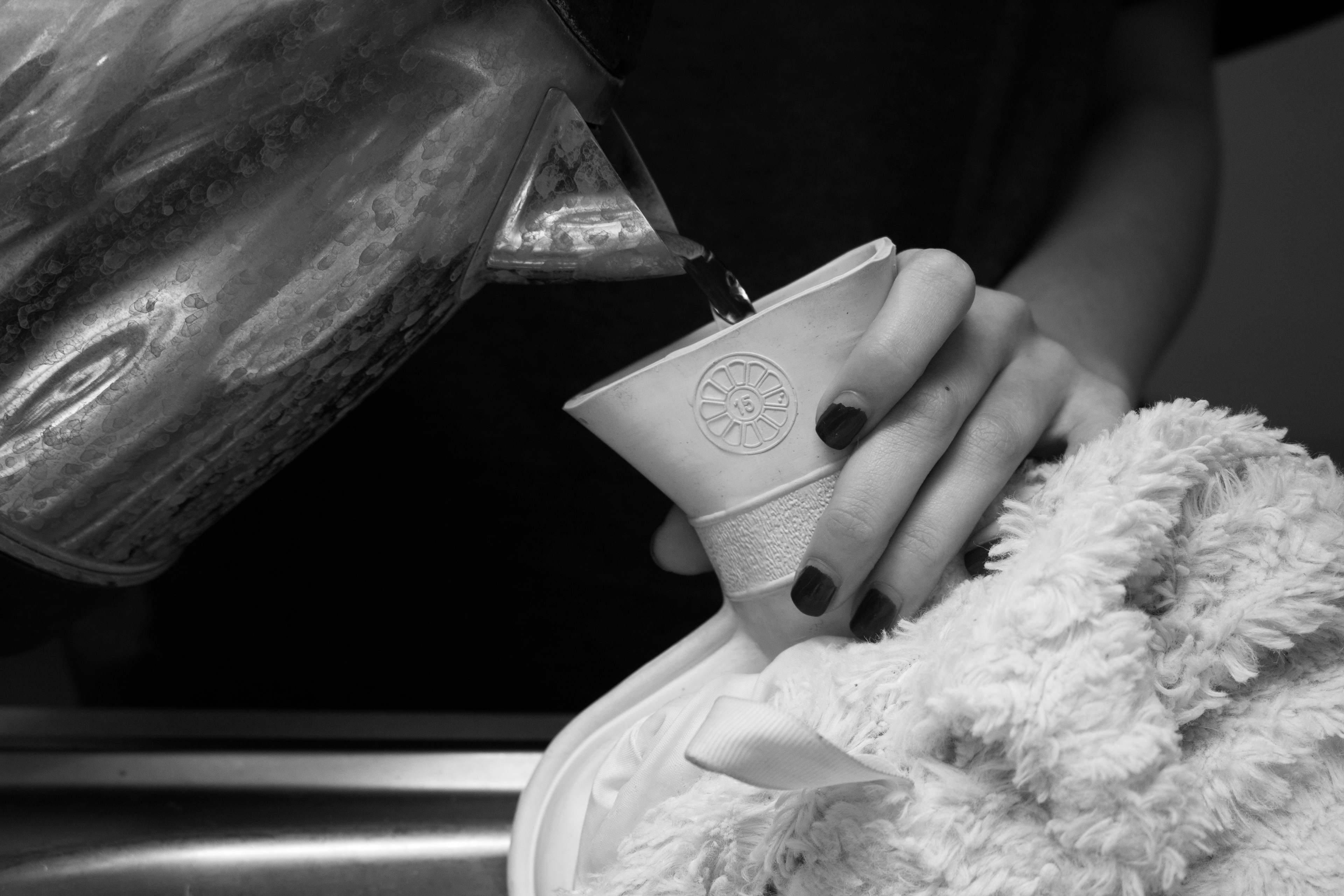 Hot water bottle being refilled