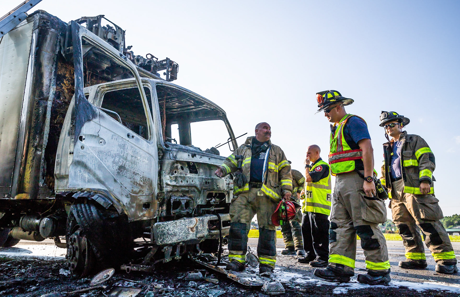 Firefighters review the cab of the box truck that caught fire August 9, 2018, on I-85 Southbound in Lexington, North Carolina.