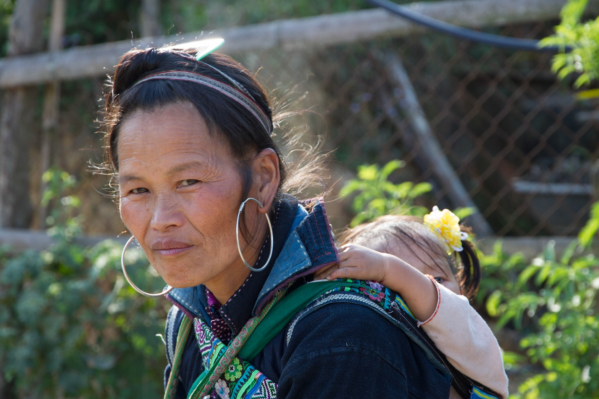 Black H'mong lady with a shy child