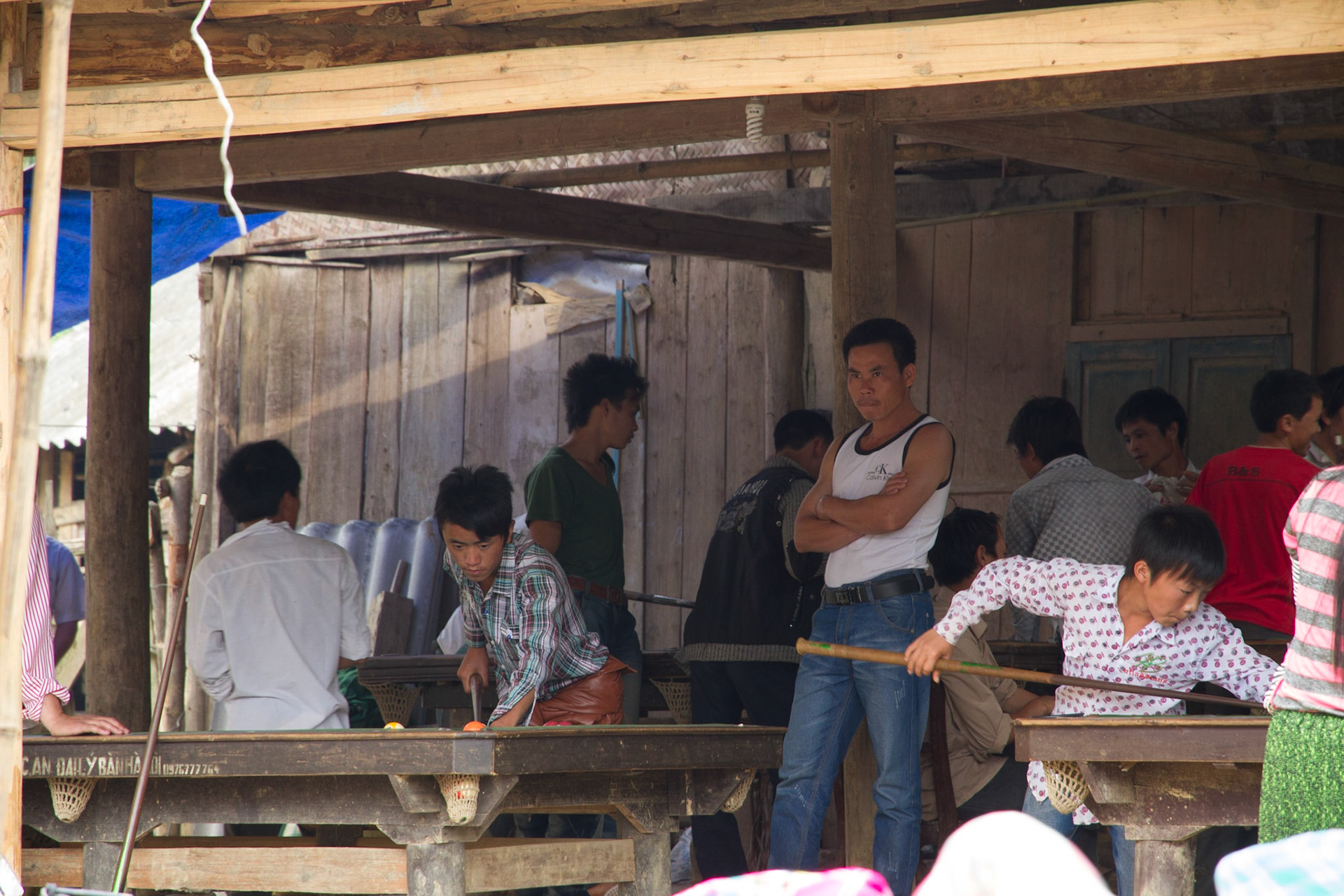 The men play pool and drink while the women shop!
