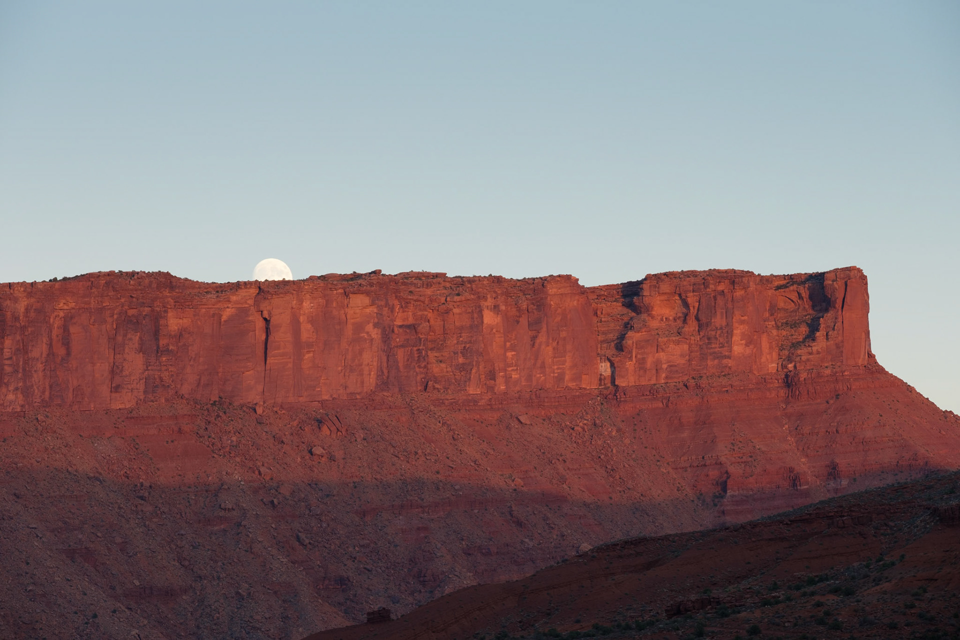 Moon rising over the mountains near Sorrel River Ranch