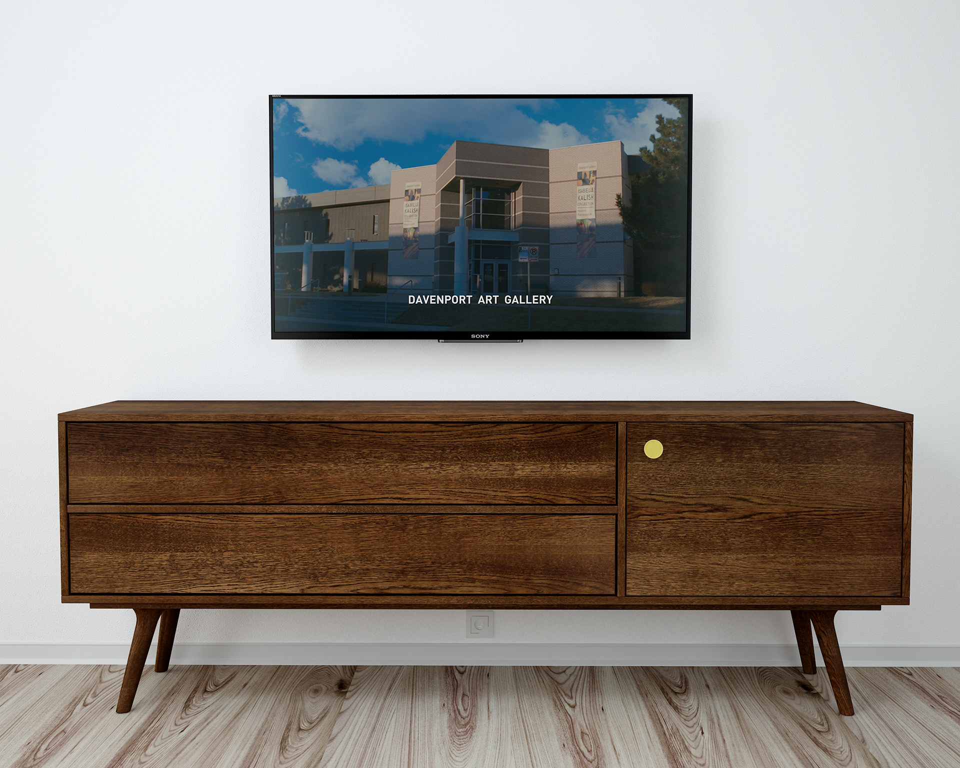 photo of a TV over a side table. On the TV screen is a still from Ransom, showing the fictional Davenport Art Gallery with event banners