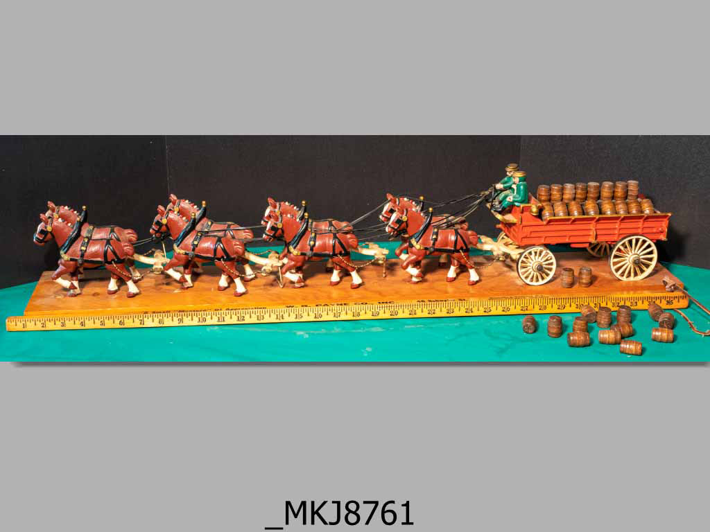 These look like the Budweiser Clydesdales, dog between the drivers
